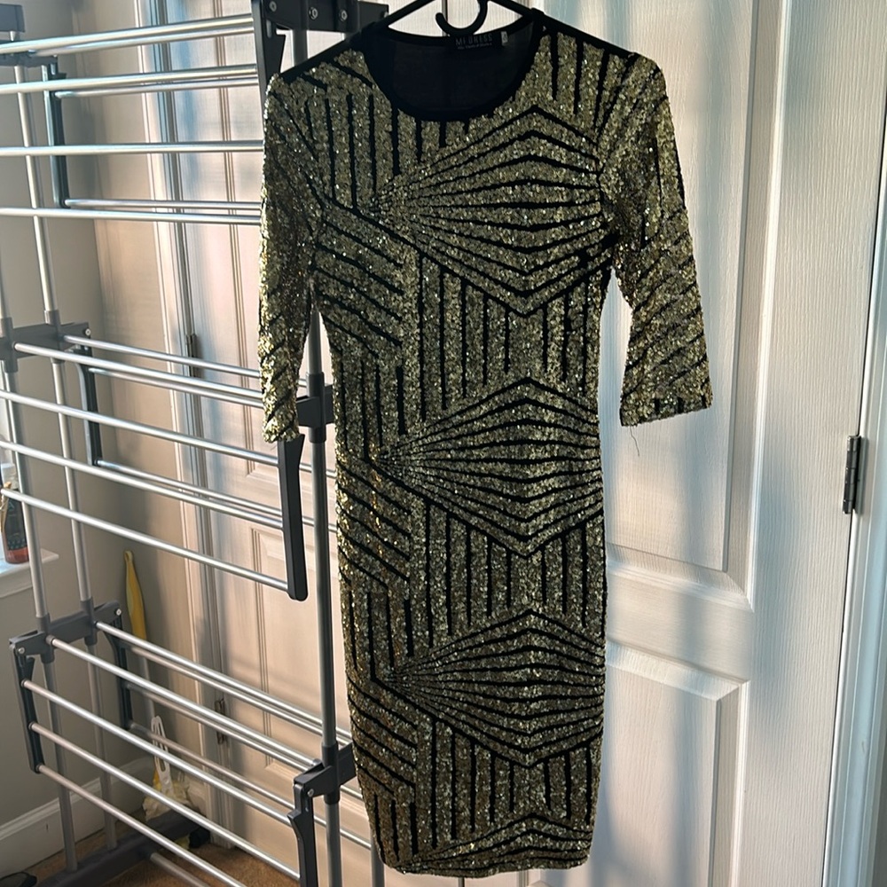 Black and gold sequin cocktail dress.